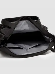 Black canvas tote shoulder bag with spacious interior and multiple pockets for daily commuting.