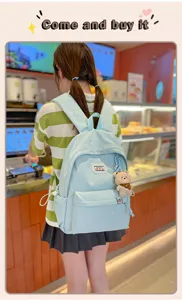 Sac à dos japonais style kawaii doux avec broderie d'étoiles et pendentif peluche pour l'école.