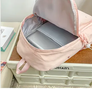 Sac a dos rose mignon compartiment pc detail, style doux etudiant vue interieure sac.