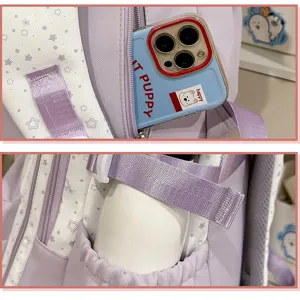Detailed shot of purple star pattern school backpack pocket storage for phone and bottle.