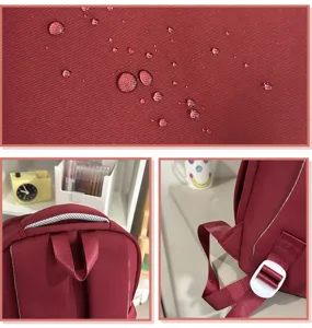 Detailed view of the red school backpack with water-resistant fabric and durable straps.