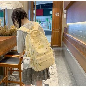 Casual star print school backpack, trendy multi-pocket canvas bookbag for daily travel.