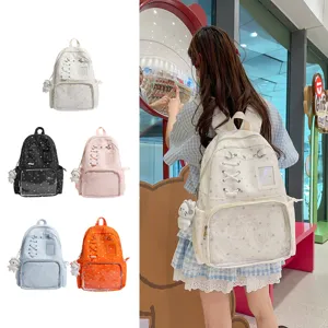 Cute transparent pocket backpack with star print, ribbon lace-up, and doll pendant for girls.