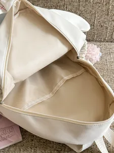Joli sac à dos blanc style ins japonais sac d'école décontracté avec pompon duveteux.