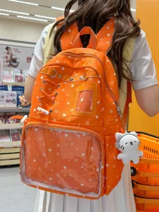 Orange clear window itabag backpack with stars and cute plush cat pendant for daily travel.