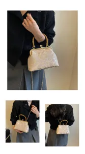 Vintage floral jacquard bamboo handle kiss lock crossbody shoulder bag detail display view