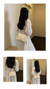 Exquisite vintage floral brocade handbag detail, elegant bamboo handle evening bag.