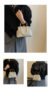 Retro floral embroidered kiss-lock evening handbag with pearl handle and chain strap for women.