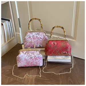 Cross-border new Chinese style kiss-lock bag vintage panda bamboo handle shoulder handbag