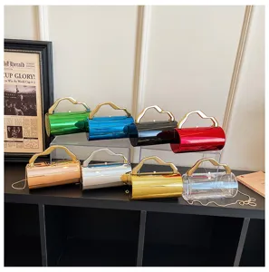 Acryl cilindrische handtas met handvat, stijlvolle crossbody kettingtas voor dames mode.