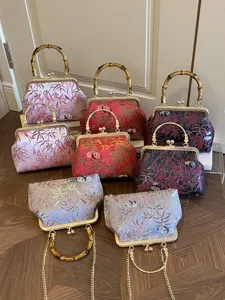 Traditional Chinese style kiss-lock handbag with panda bamboo print and bamboo handle for women.
