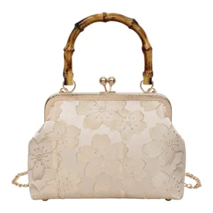 Vintage bamboo handle brocade evening handbag, elegant floral kiss lock shoulder cross body bag.
