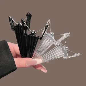 Root volumizer hair clips for volume and styling, black and clear plastic, easy to use unisex.