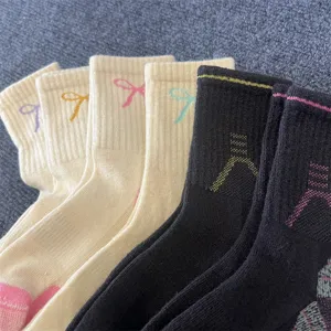 Merino wool mid-calf socks for women, winter warm thick loop bow design, casual outdoor wear.
