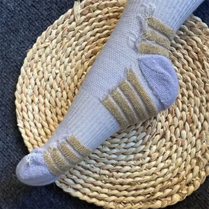 Merino wool ski socks detail, purple ribbed compression arch for outdoor sports women.