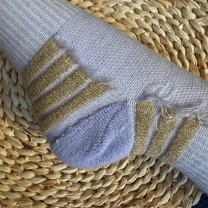 Detail shot of knitted striped long socks heel, warm winter wool blend sports socks close-up view