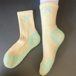 Merino wool thermal mid-tube socks for women, thick loop-knit winter warm socks with cute bow.