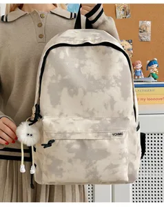 Detail view of the trendy tie-dye backpack, featuring a unique cloud pattern and front pocket.