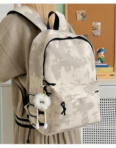 Stylish tie-dye canvas backpack with plush keychain, large capacity casual daypack for daily.