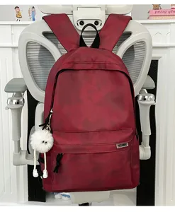 Detail shot of the red tie-dye casual backpack showing its unique pattern and texture.