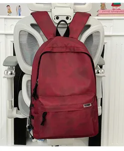 Tie-dye large capacity backpack for students and daily commute, casual durable school bag.