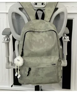 Casual tie-dye backpack for college students, large capacity commute daypack with cute charm.
