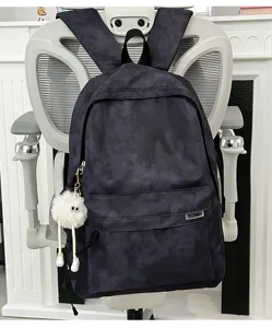 Stylish tie-dye large capacity school backpack with cute plush charm for casual daily commute.