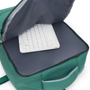 Unisex casual minimalist green backpack, spacious interior compartment for daily travel and school.