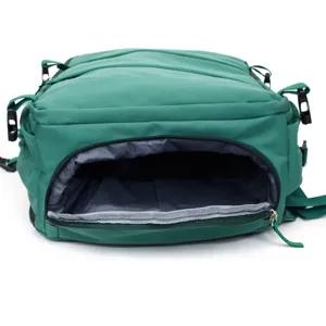 Close-up detail view of the dark green backpack interior lining and zipper opening structure.