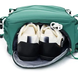 Detailed view of green backpack featuring a separate bottom shoe compartment and sneakers.