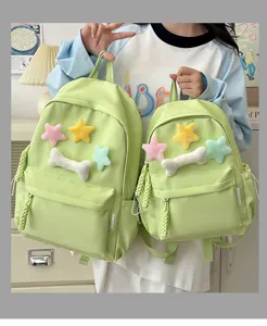 Cute green student school backpack with plush star decorations, stylish campus style rucksack.