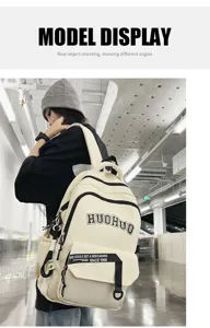Detailed view of the vintage campus style large capacity student laptop backpack worn by model.