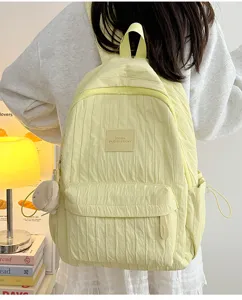 Solid color lightweight school backpack for daily travel, casual student bookbag with multiple pockets.