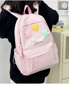 Pink cute student backpack with plush star and bone details, casual daily school book bag.