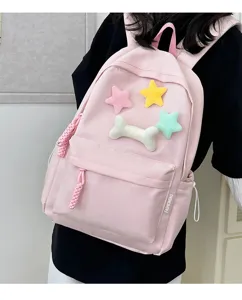 Pink student backpack with cute plush star and bone decorations, stylish daily casual bag.
