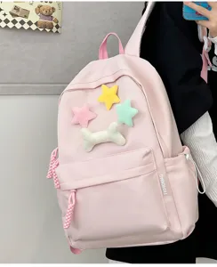 Pink casual student backpack with cute plush stars and bone charm, stylish daily school bag.