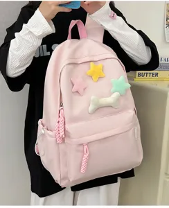 Pink student backpack with cute plush star and bone patches, casual daily school bag for girls.