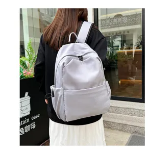 Casual solid color large capacity backpack for daily travel, school, and casual outdoor use.