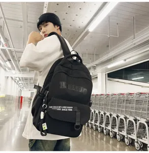 Retro casual black backpack for students, large capacity college style canvas bookbag.