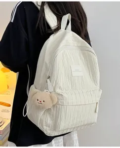 Solid color white pleated backpack for women and girls, casual daily travel school bag.
