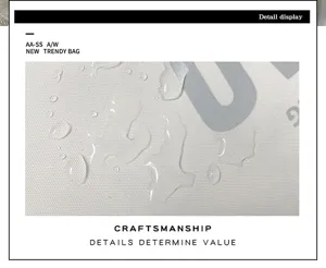 Detailed view of waterproof backpack fabric material showing excellent water resistance.