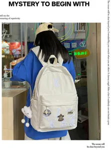 Minimalist large capacity canvas school backpack with letter embroidery for students travel.