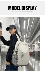 Detailed view of the large capacity casual backpack worn by model in station scene, stylish daily.