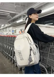 Large capacity canvas backpack with color blocking design, ideal for students and daily commute.