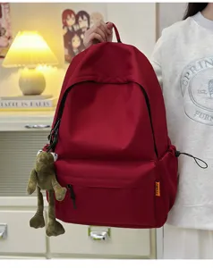 Detail view of large capacity solid color backpack, minimalist Japanese school bag for students.