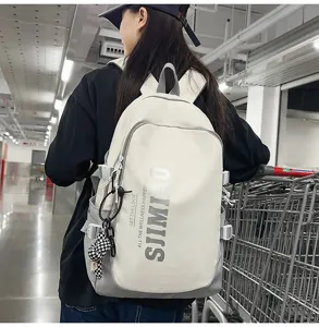 Detail view of large capacity casual backpack worn by student, showing printed slogans.