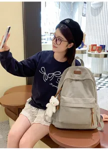 Corduroy backpack for women and students stylish casual travel daypack with cute bear pendant.