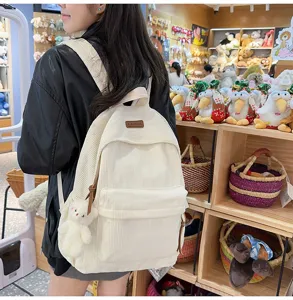 Corduroy backpack for women, large capacity stylish school bag with cute bear pendant, casual travel.