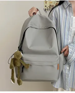 Large capacity solid color minimalist backpack casual school bag for students daily use.