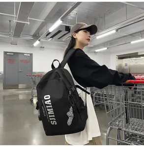 Large capacity black backpack for students, stylish casual school bag with front zipper design.